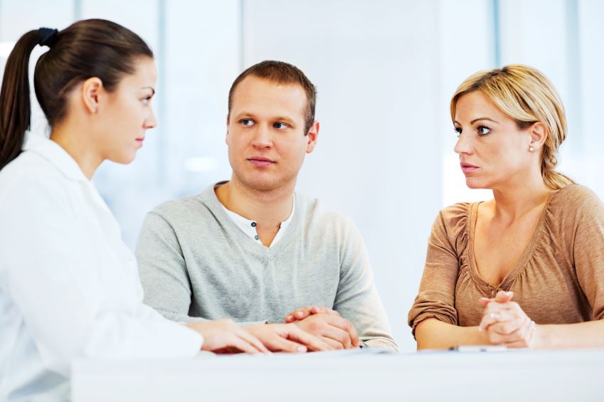 Young family visiting a therapist.